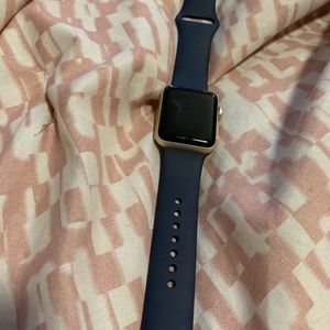 Apple Watch 38MM. Gold trim with blue straps